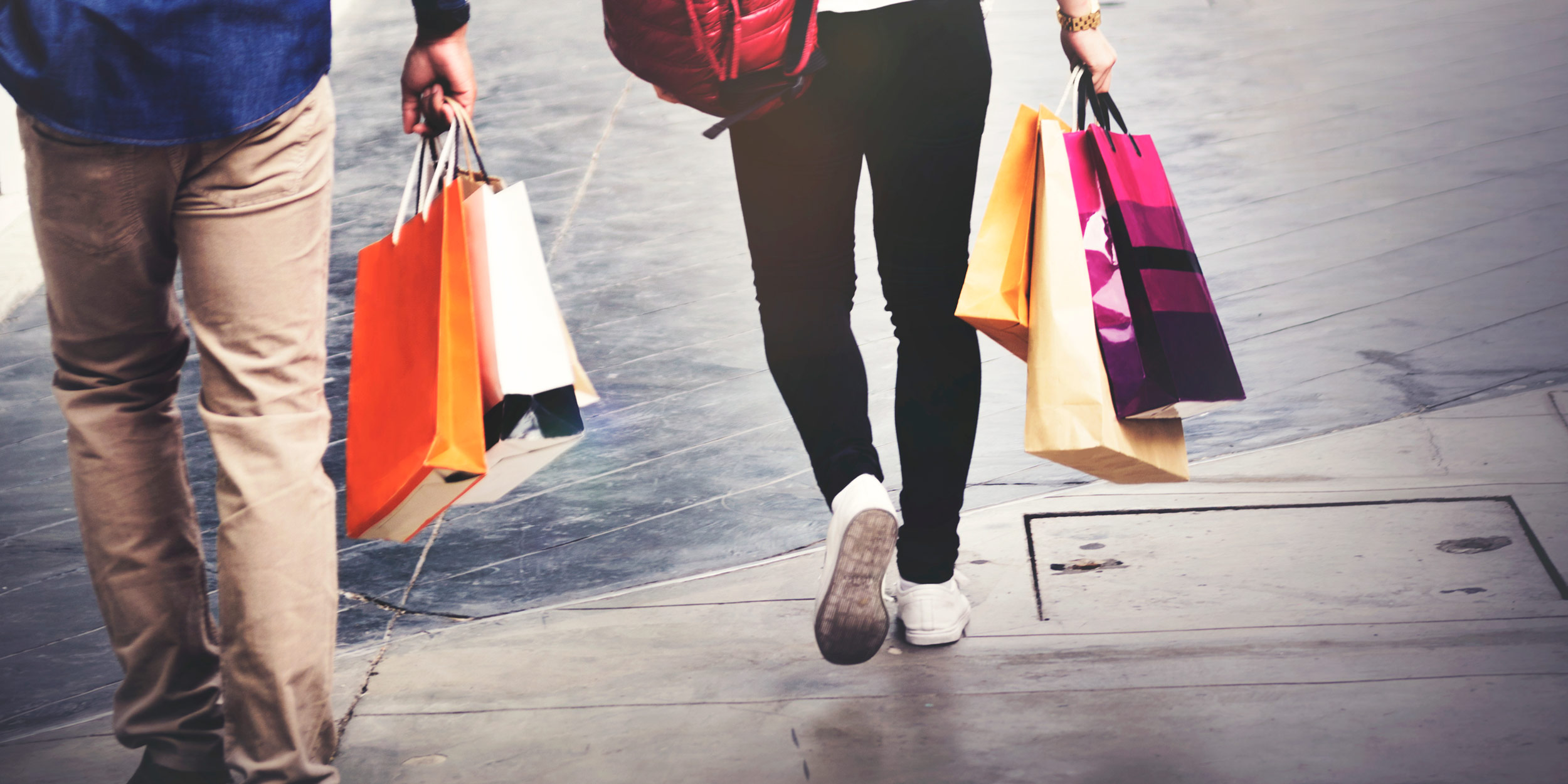 People in the street with shopping bags